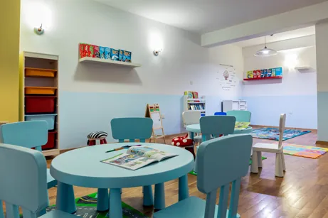 Creative studio with art tables and book ledges