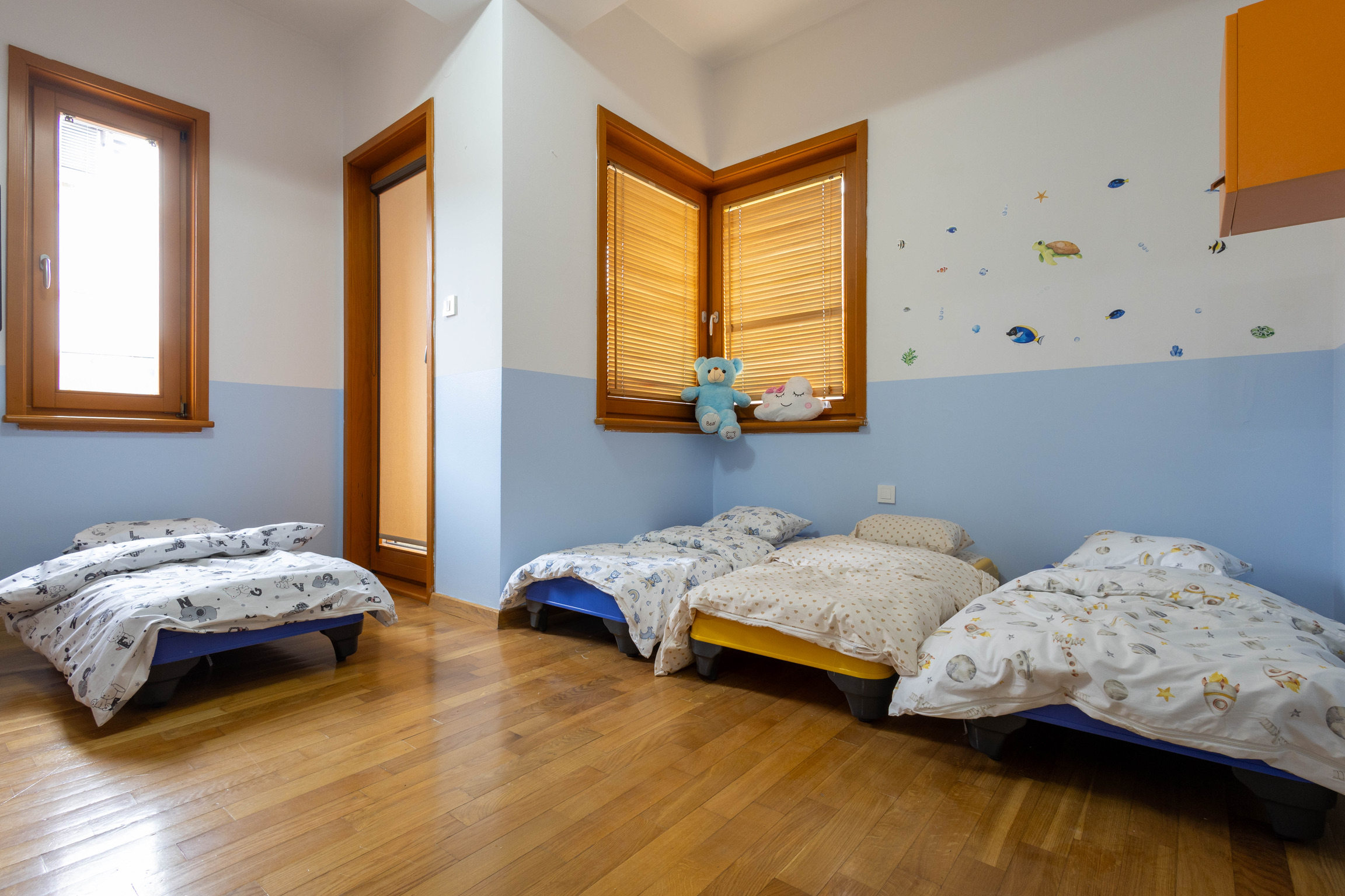 Quiet rest room with calm blue tones and soft beds